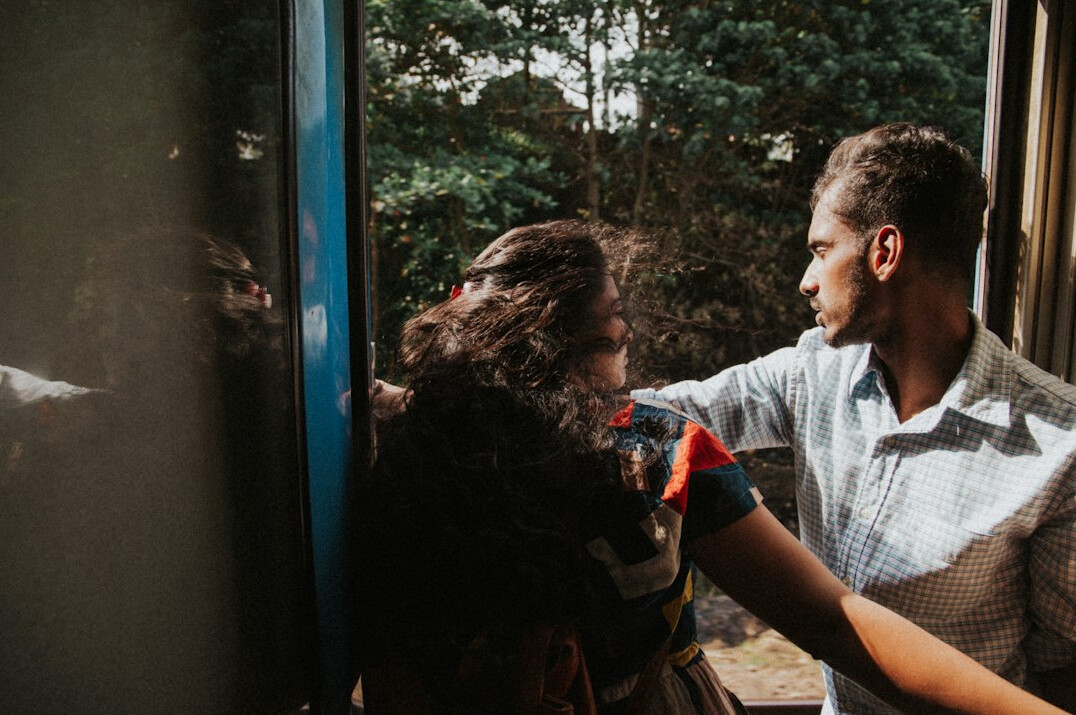 Small group of colleagues having a discussion near a window